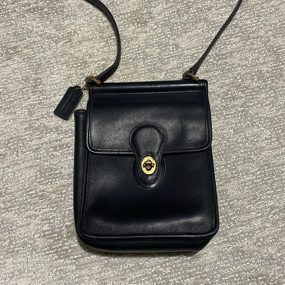 Vintage black Coach mini leather bag with brass detailing.
